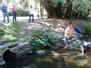 Get some water to test (Drexel Park, Valdosta, Georgia) Students getting water from creek for Adopt-A-Stream water quality testing training.