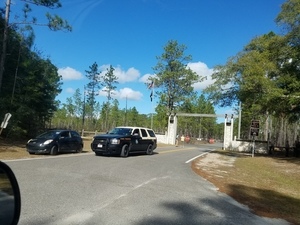 Park Ranger and state trooper cars at closed SRSP gate, 30.3783555, -83.1655342