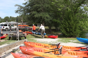 [Bret helping a canoe out]
