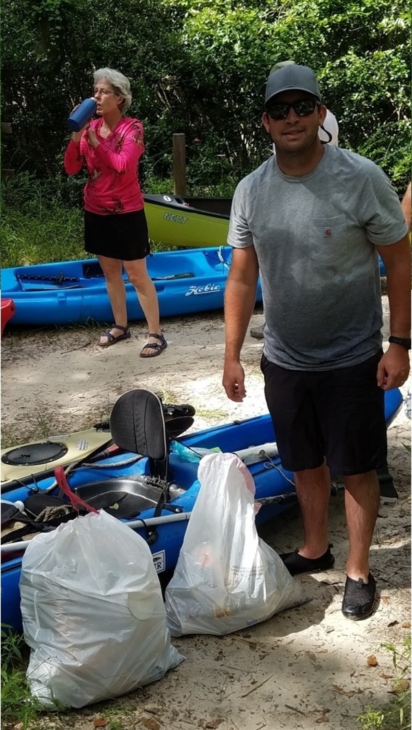 Kerry Sullivan with trash we collected (Shirley Kokidko in background), 30.48014, -83.24466