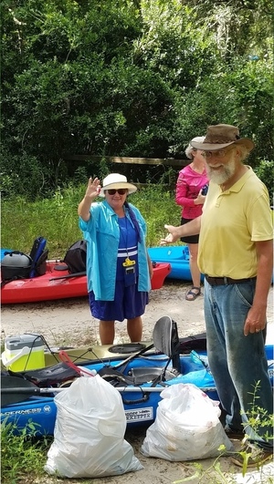 [Julie Bowland with the fishing float she collected, 30.48012, -83.24475]
