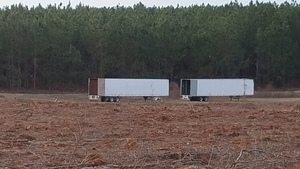 [Closeup 2 STT trailers W of SW 40th Ave., 17:37:13, 30.4576196, -83.1780774]