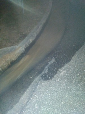 [More into a storm drain]