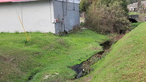 [Mega Mart trash into One Mile Branch upstream from Lee Street, 15:58:36, 30.8485500, -83.2779730]