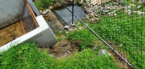[Erosion at Lee Street Detention Pond Trash Trap, One Mile Branch, 2023:05:23 15:06:52, 30.8467603, -83.2779651]