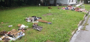 [Trash looking east on Pullman Street towards S. Toombs Street, 2023:05:23 15:57:45, 30.8215560, -83.2775840]