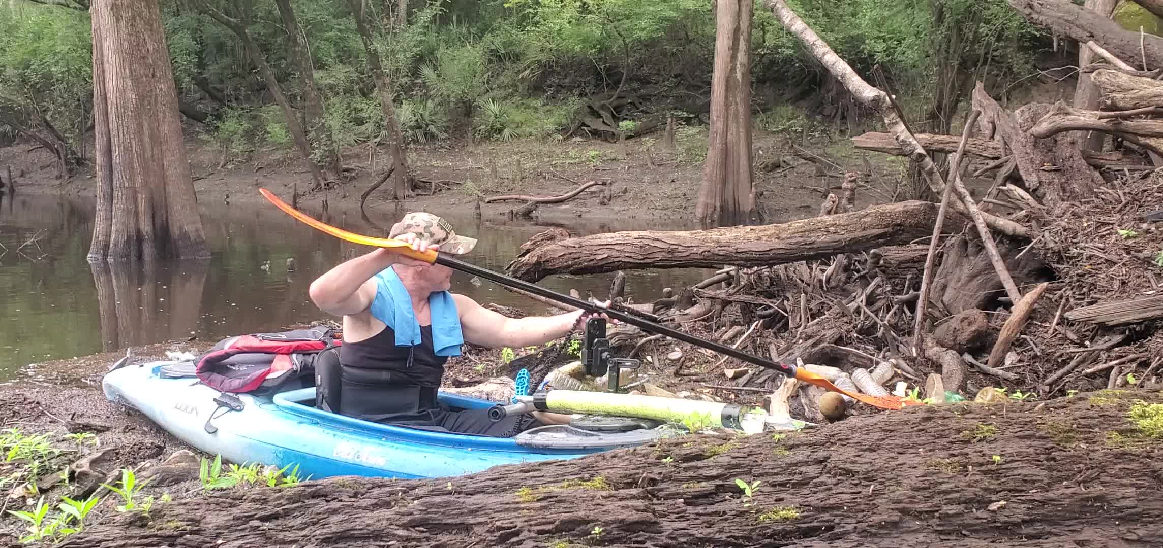 Movie: Russell and his paddle spoon, trash on the Withlacoochee River, 12:11:11, 30.6949983, -83.4426854 (52M)