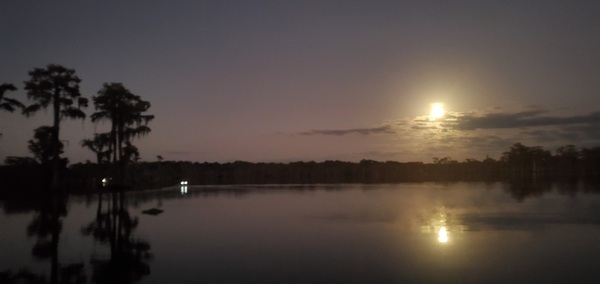 [Boat lights moon]