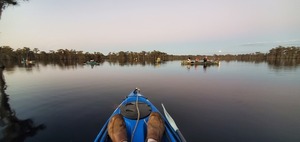 [Many boats and moon in cloud]