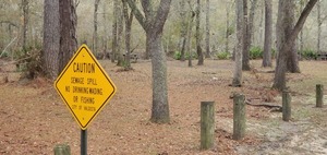 [Closeup, sewage spill sign, 08:44:18, 30.8866932, -83.3231449]