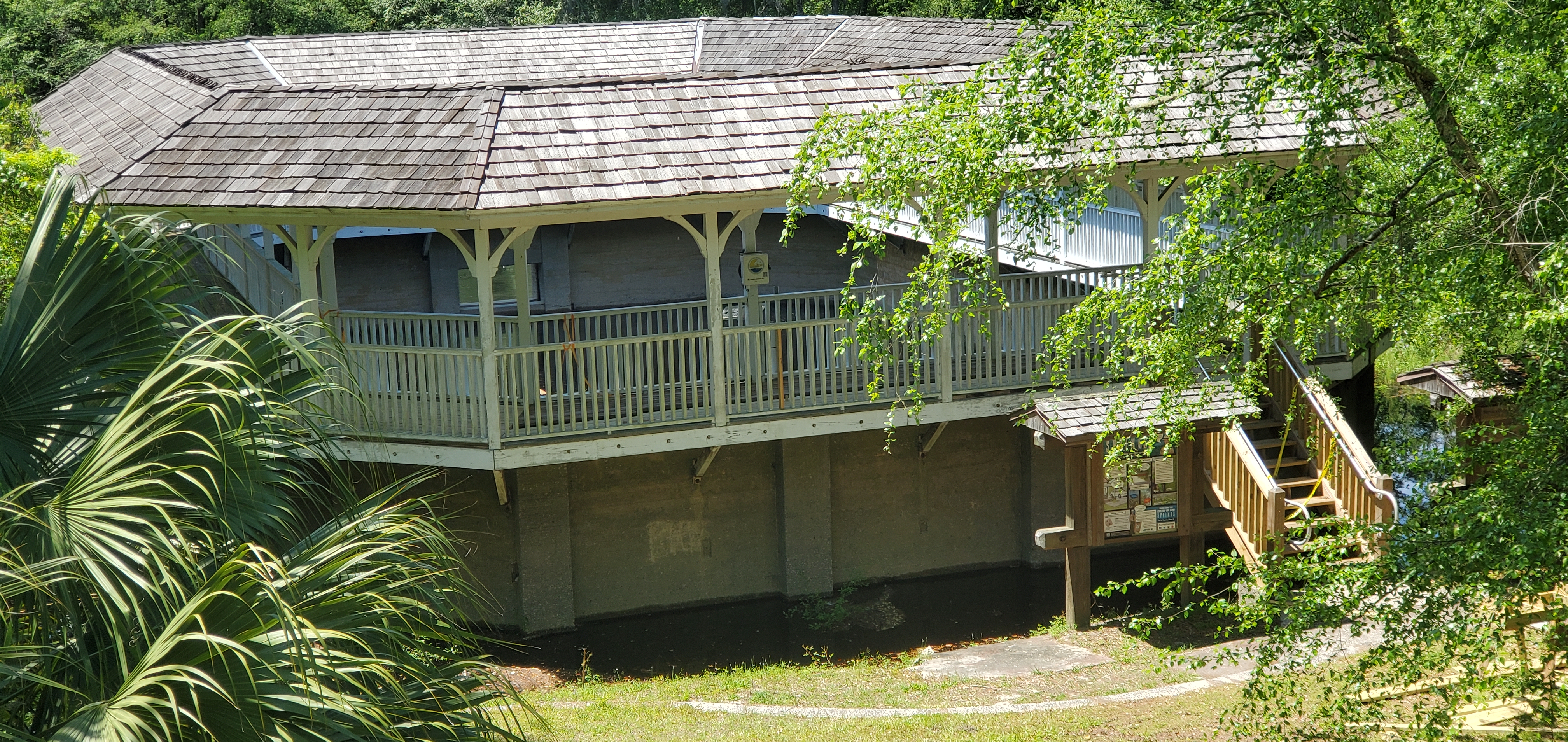 Water is up to the bottom of the far window of the White Sulphur Springs Spring House, 12:38:56, 30.3300340, -82.7604910