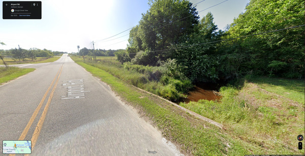 [Hat Creek looking back east to spilling manhole at Sylvia Drive --Google Streetview]