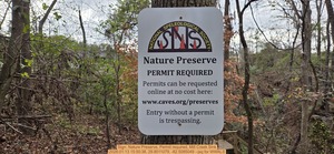 [Sign: Nature Preserve, Permit required, Mill Creek Sink, 2026:01:13 15:50:36, 29.8011079, -82.5085049 --jsq for WWALS]