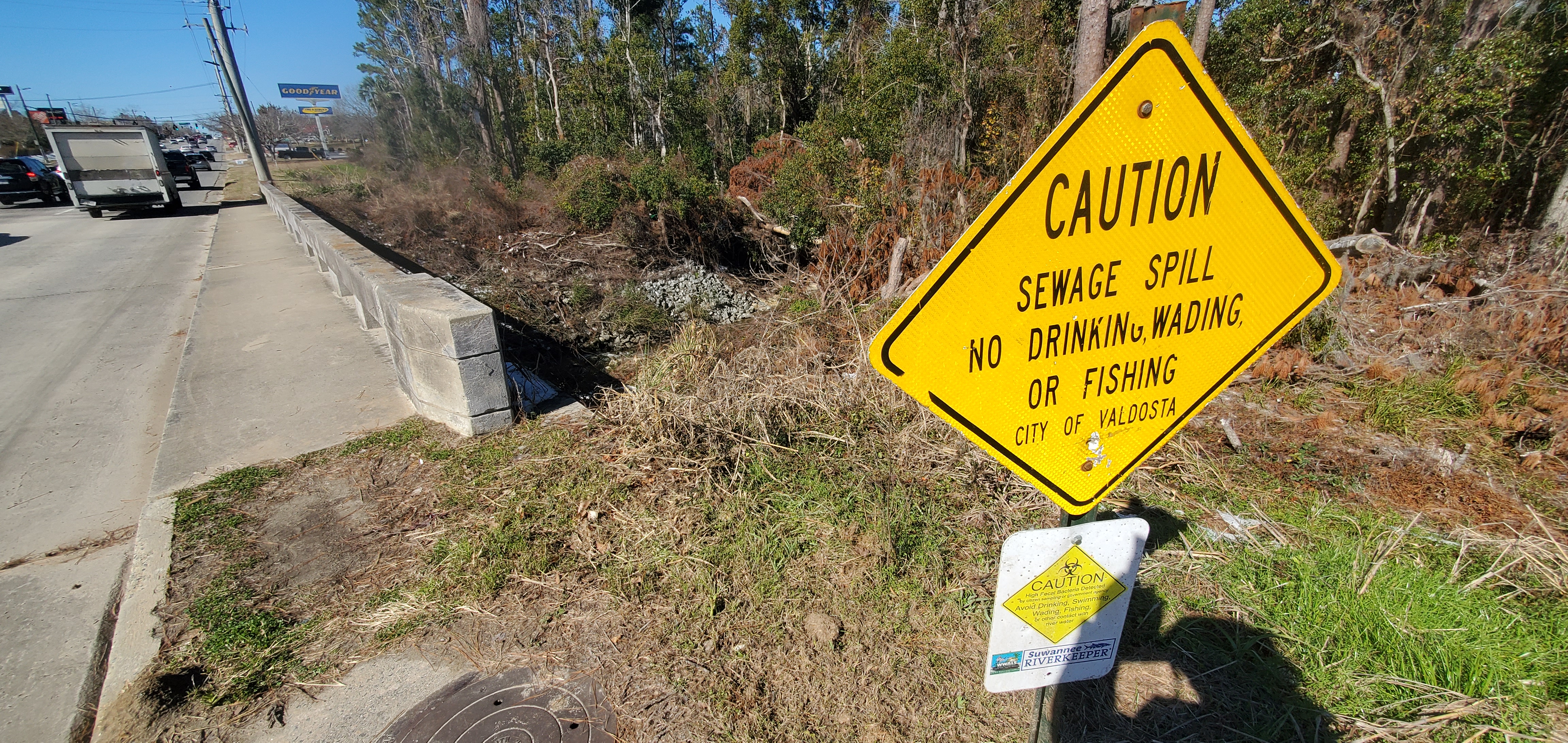 Contamination signs and Sugar Creek at Baytree Road, 11:55:55, 30.8469788, -83.3135502