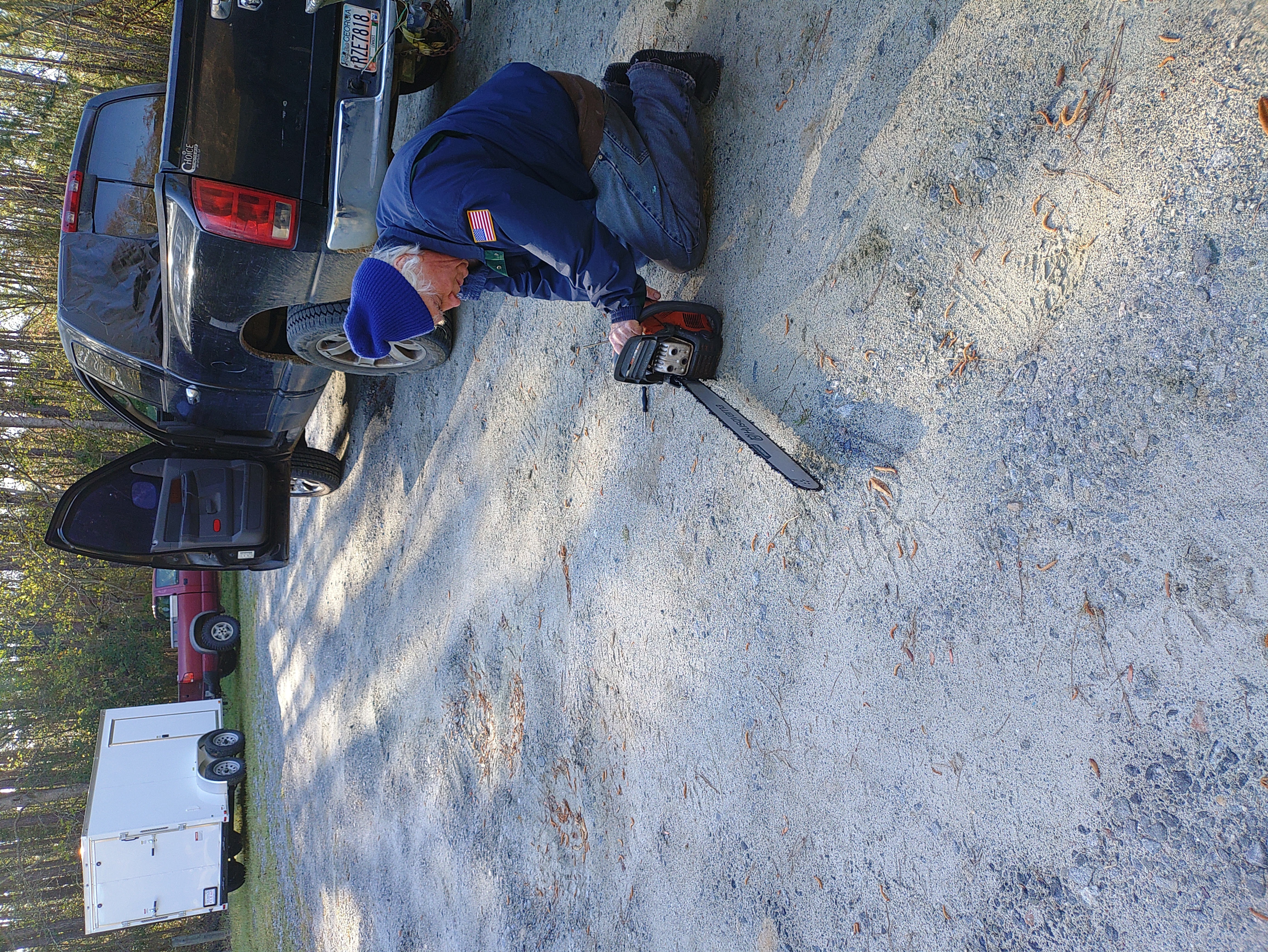 Phil Hubbard re-idling the 24-inch Husqvarna chainsaw --Phil Royce, 2025:03:22 09:35:50