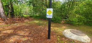 [Manhole, WWALS Caution Sign, path to Berta's Beach, Sugar Creek, 11:52:11, 30.8614729, -83.3188925]