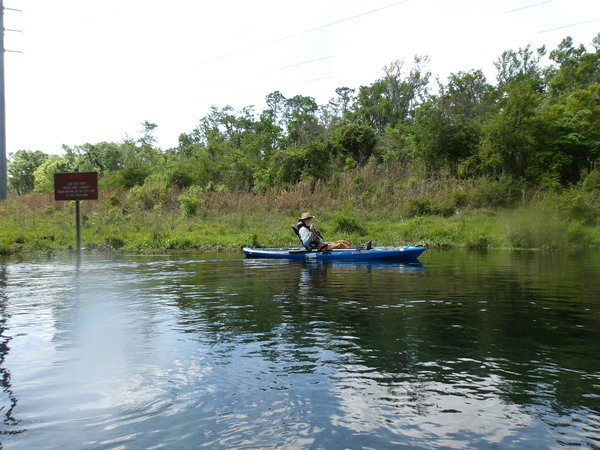 jsq waving at Last Exit Point sign --Janet Martin