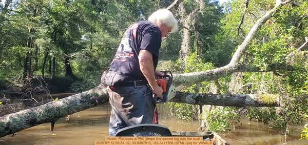 Movie: Phil does a Phil (drops the sawed log into the boat), 2025:07:12 09:54:02, 30.8457012, -83.3471106 (37M) --jsq for WWALS