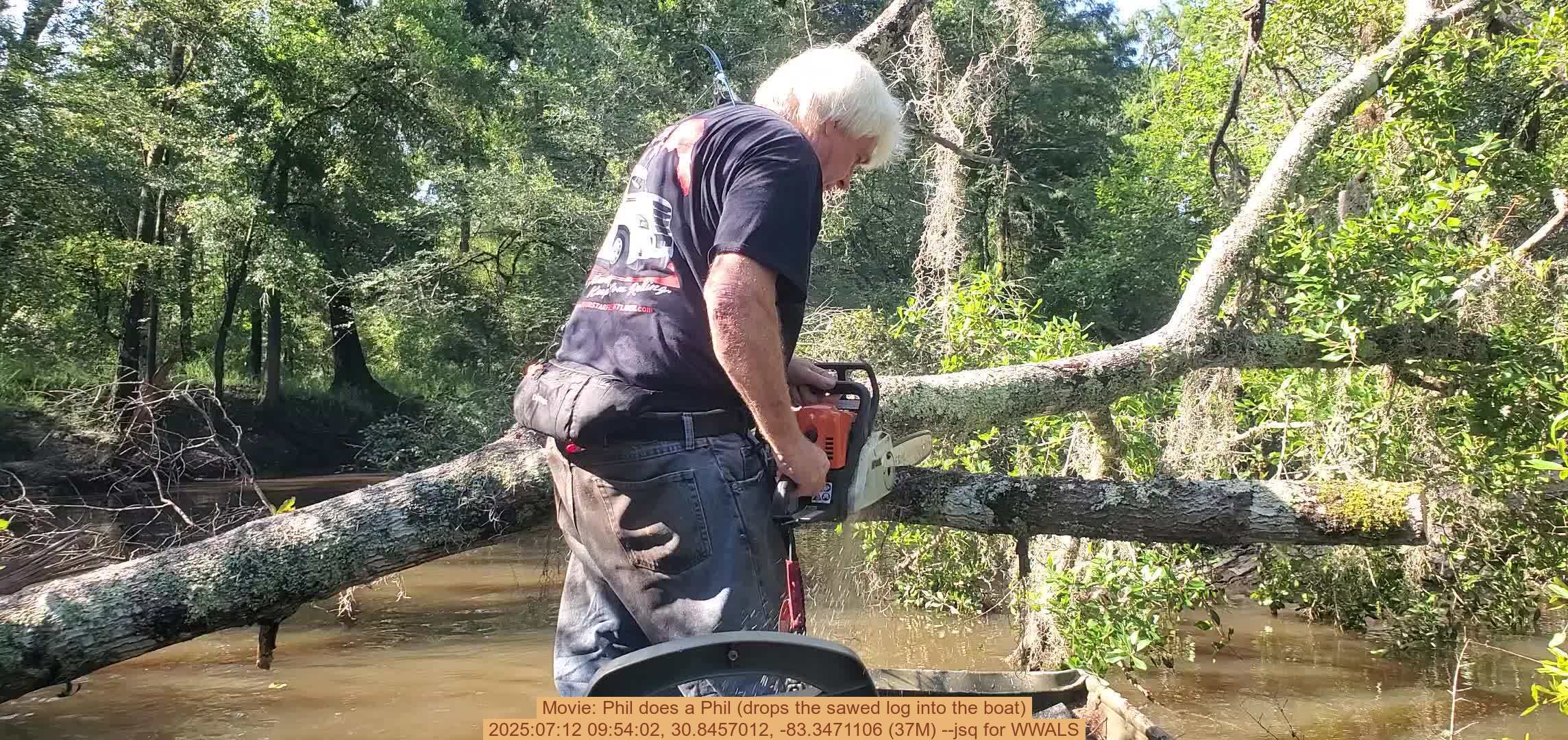 Movie: Phil does a Phil (drops the sawed log into the boat), 2025:07:12 09:54:02, 30.8457012, -83.3471106 (37M) --jsq for WWALS