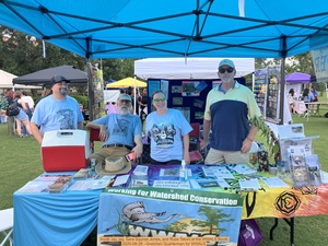 [Scotti Jay, jsq, Sara Squires Jones, and Russ Tatum at the WWALS Booth, 2025-08-28 --Gretchen Quarterman for WWALS]