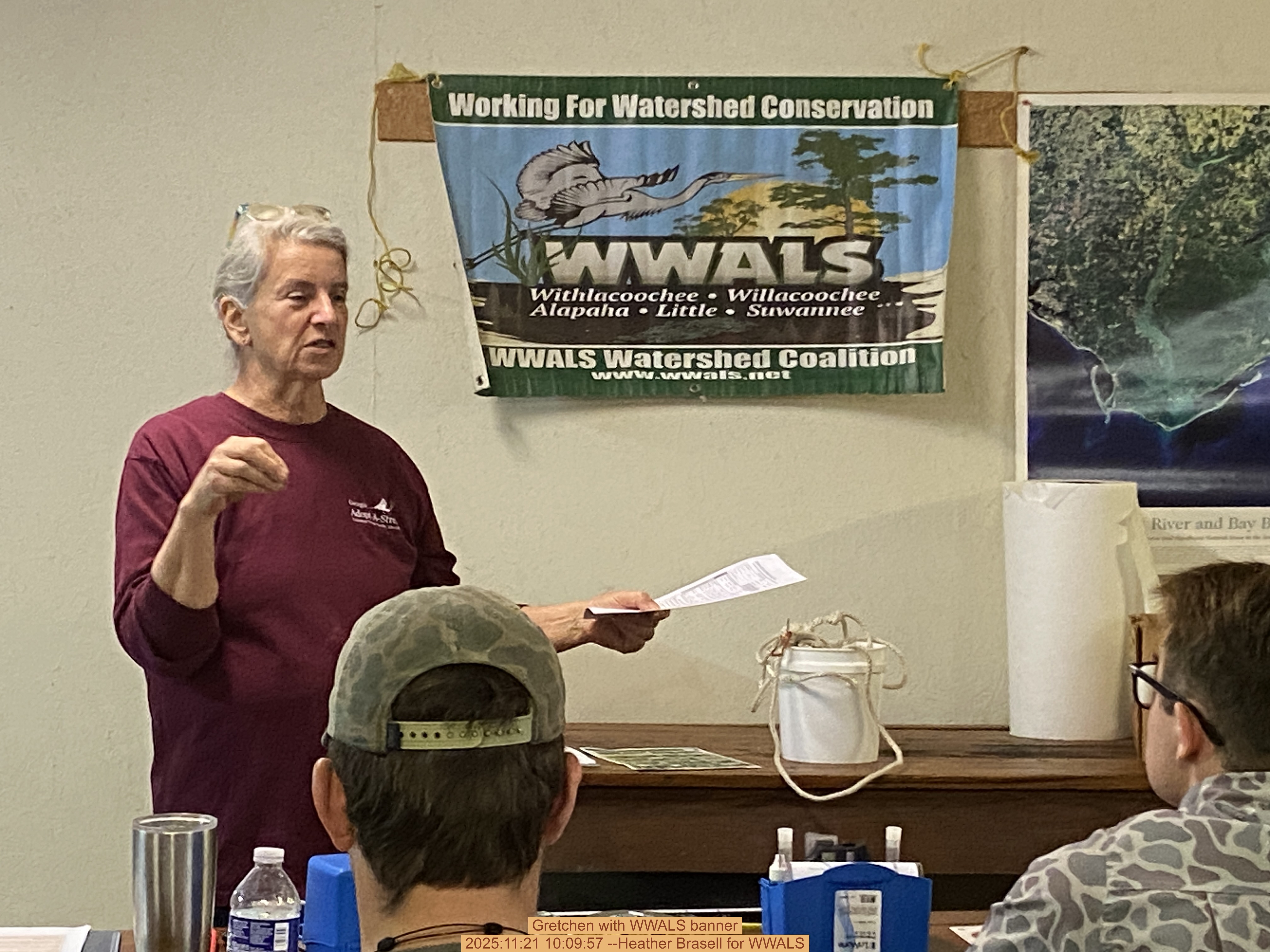 Gretchen with WWALS banner, 2025:11:21 10:09:57 --Heather Brasell for WWALS