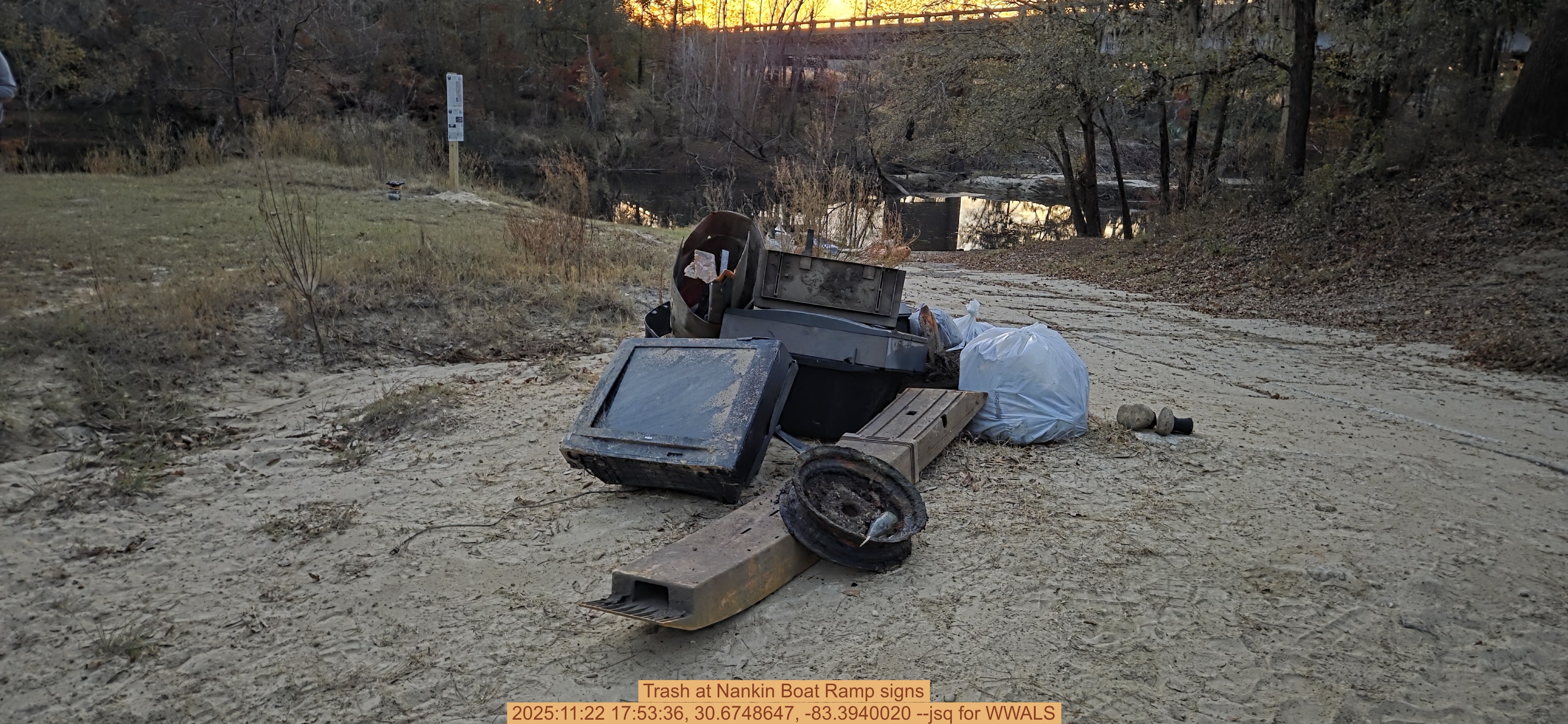 Trash at Nankin Boat Ramp signs, 2025:11:22 17:53:36, 30.6748647, -83.3940020 --jsq for WWALS