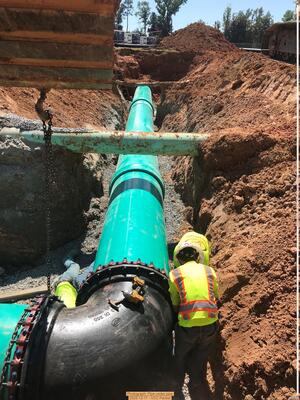 [Photograph: Pipe under pipe, 2025-12-11 --VCC Packet]