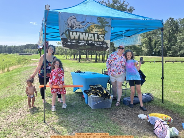 [Children at WWALS tent with Kim, 2026:06:20 11:15:22, 31.1621361, -83.5479444 --Gretchen Quarterman for WWALS]