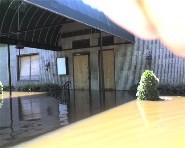 [Boarded up and flooded]