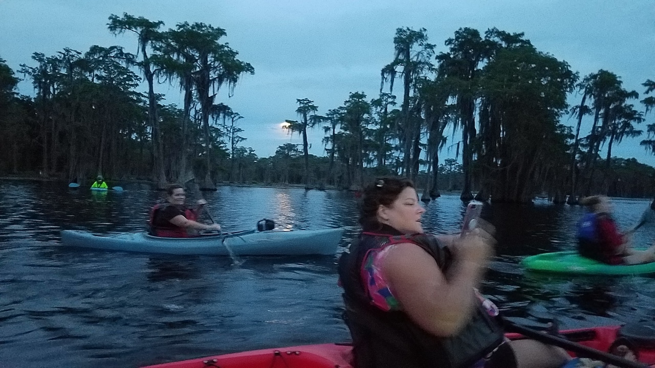 Full moon rising over Banks Lake with paddlers