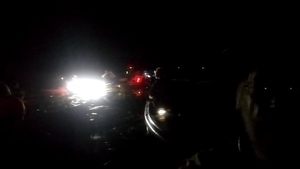 [Blurry lighted paddlers on Banks Lake]