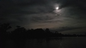 [Moon over dark cloud]