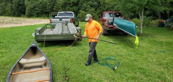 [Russell washing the canoes, 14:57:51, 30.8365549, -83.5225833]