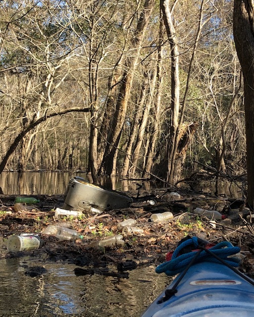 [Cooler against log about 50 feet from Sugar Creek Confluence]