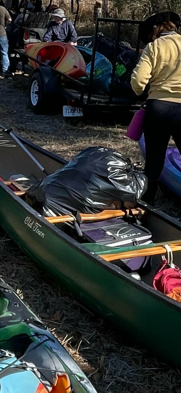 [Trash in canoe at Spook Bridge, Withlacoochee River 2022-02-19 Photo: Bobby McKenzie]