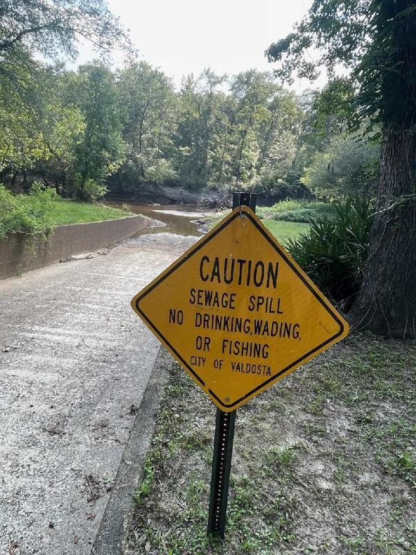 [At Langdale Park Boat Ramp: Caution Sewage Spill City of Valdosta --Bobby McKenzie 2023-07-21]