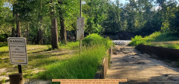 [WWALS Water Trail and Valdosta Sewage signs at Langdale Park Boat Ramp, 2025:07:19 18:12:49, 30.88747, -83.32395 --jsq for WWALS]