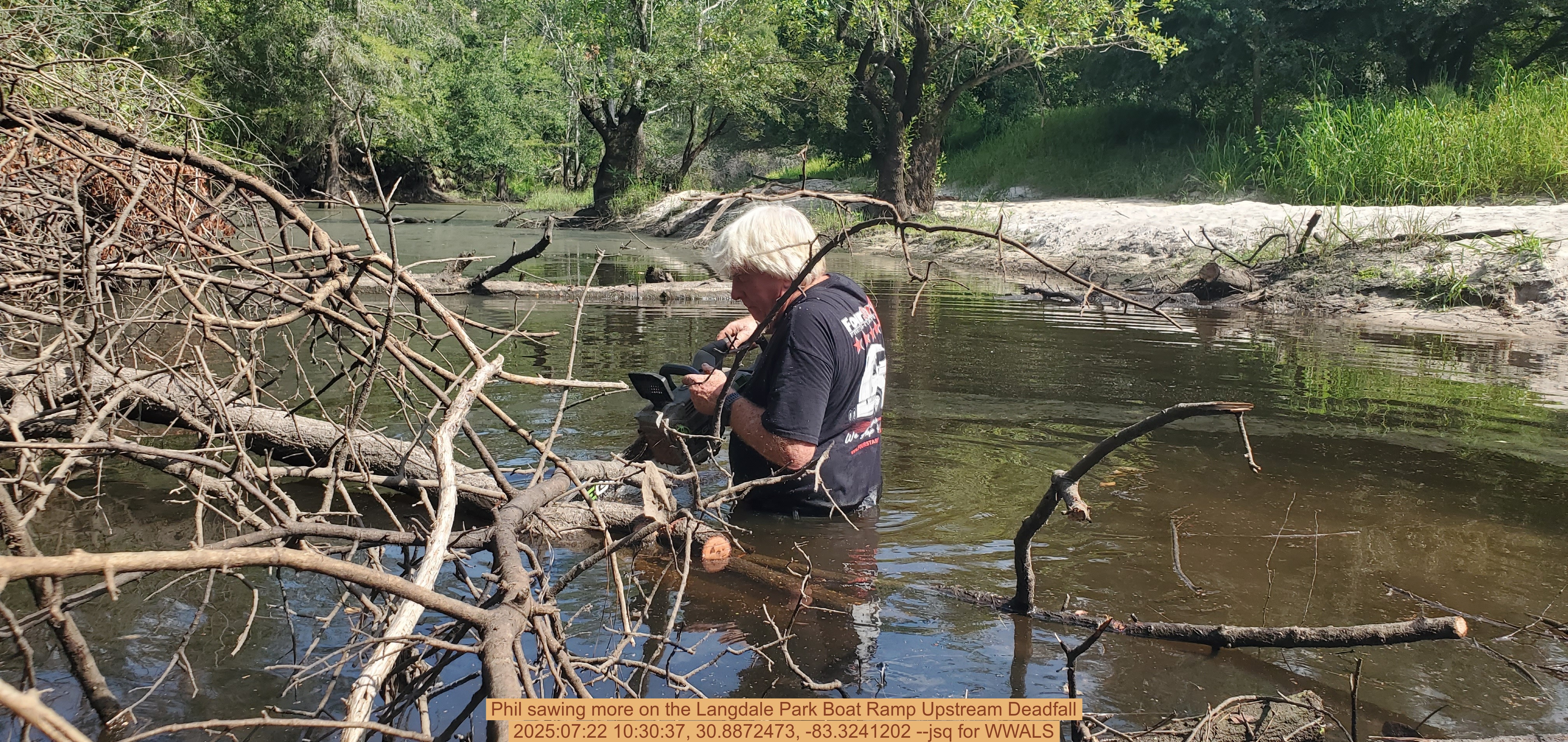 Phil sawing more on the Langdale Park Boat Ramp Upstream Deadfall, 2025:07:22 10:30:37, 30.8872473, -83.3241202 --jsq for WWALS