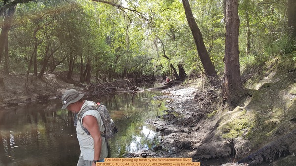 [Bret Miller picking up trash by the Withlacoochee River, 2019:08:03 10:53:44, 30.9793607, -83.2649092 --jsq for WWALS]