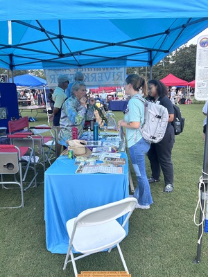 [Gretchen and students at WWALS Booth]