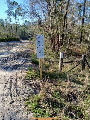 [Access road and ARWT At-Water Signs, Mayday Landing, 2025-02-26 --Echols County]