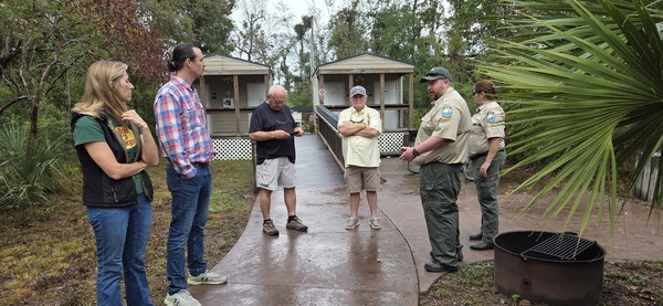 [Talking by the bathrooms, Dowling Park River Camp, 2025:09:27 10:24:50, 30.2467921, -83.2461671]