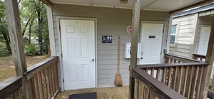 [Bathrooms outside, Adams Tract River Camp, 2025:09:27 11:30:35, 30.0348596, -83.0193468]