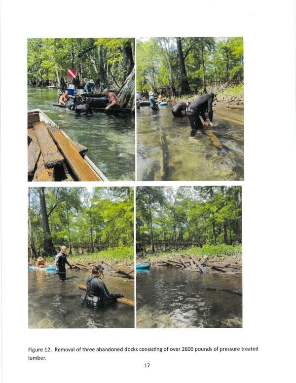 [Figure 12. Removal of three abandoned docks consisting of over 2600 pounds of pressure treated lumber.]