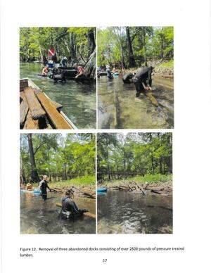 [Figure 12. Removal of three abandoned docks consisting of over 2600 pounds of pressure treated lumber.]