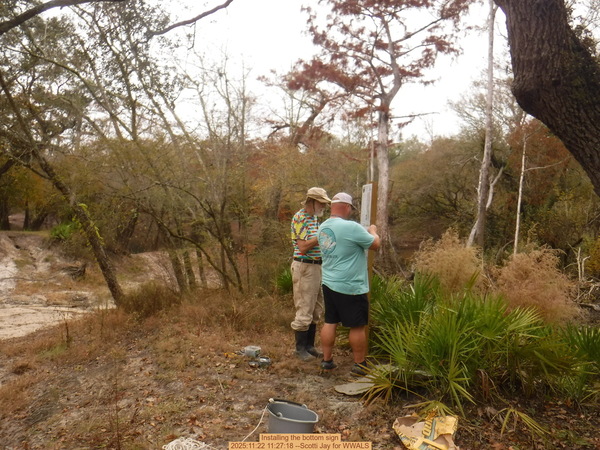 Installing the bottom sign, 2025:11:22 11:27:18 --Scotti Jay for WWALS