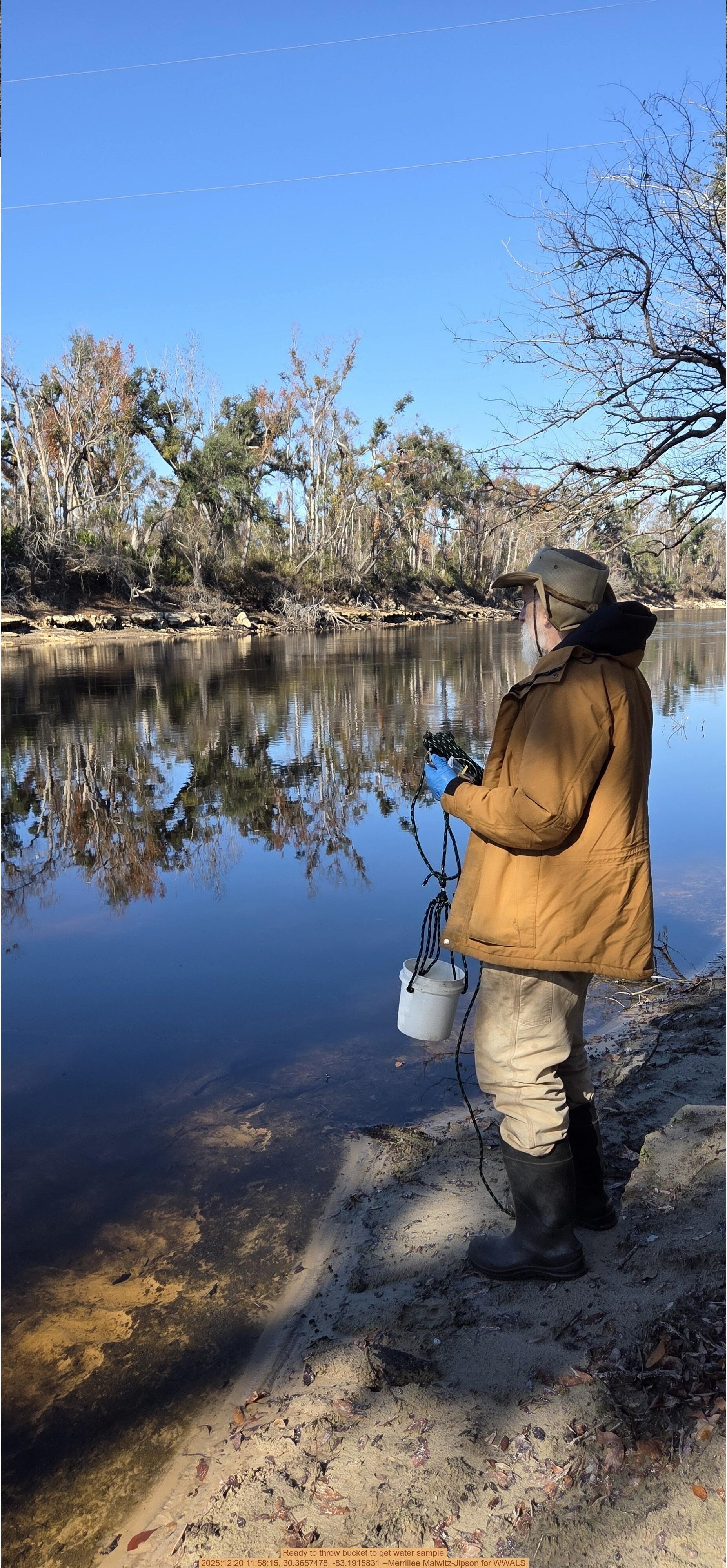 Ready to throw bucket to get water sample, 2025:12:20 11:58:15, 30.3657478, -83.1915831 --Merrillee Malwitz-Jipson for WWALS