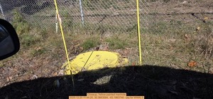 [Closeup, Yellow-painted manhole, 2025:12:20 11:44:20, 30.3663584, -83.1863746 --jsq for WWALS]