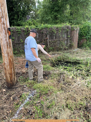 [Scotti Jay watching Valdosta Stormwater Manager Angela Bray take water temperature using Gretchen Quarterman's WWALS thermometer, 2026:04:23 15:46:36, 30.8596222, -83.3185972 --Gretchen Quarterman for WWALS]