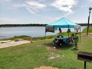 [WWALS tent and boats, 2026-06-20 --Gretchen Quarterman for WWALS]